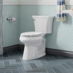 Kohler Highline Arc 12-Inch Rough-In Two-Piece Elongated Chair Height Toilet with Single Flush (1.28 GPF) in White, featuring a Soft Close Seat.